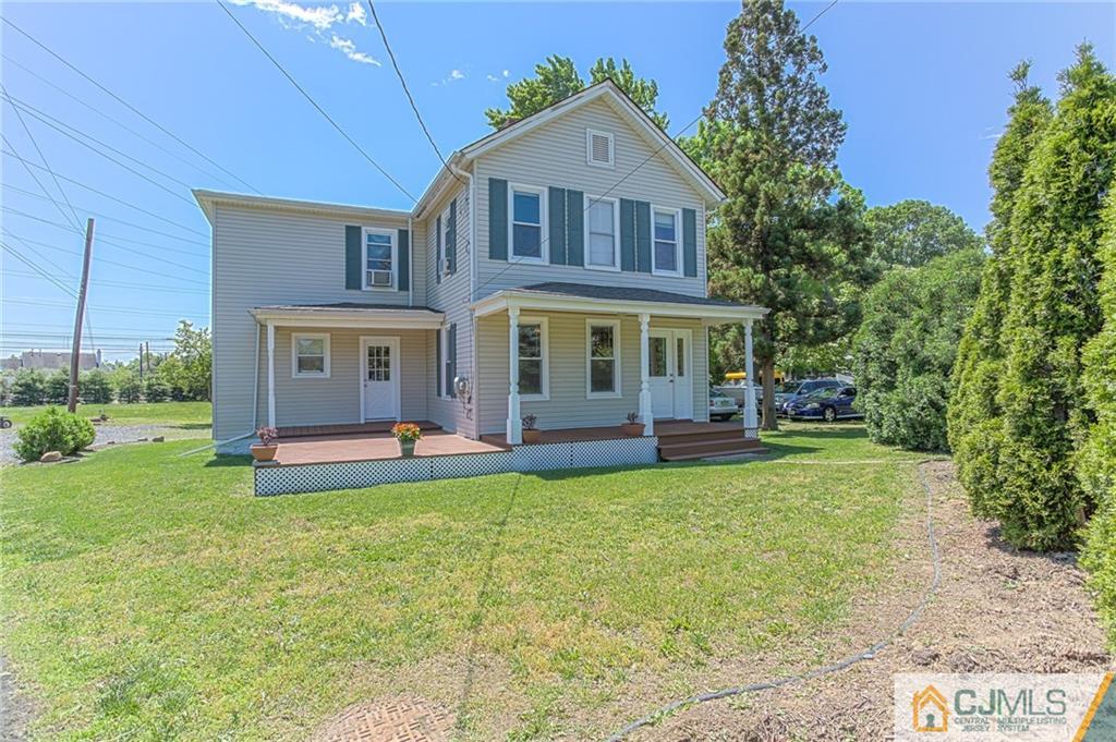 659 Ridge Road Monmouth Junction, NJ 08852 - Photo 3 of 24 a view of a house with a yard porch and sitting area