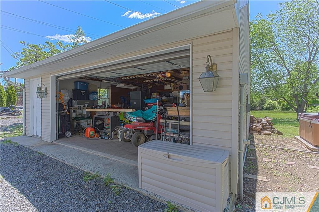 659 Ridge Road Monmouth Junction, NJ 08852 - Photo 21 of 24 a view of a garage with parked cars