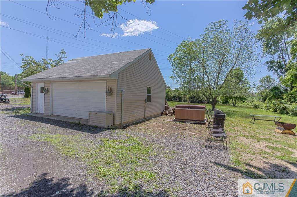 659 Ridge Road Monmouth Junction, NJ 08852 - Photo 24 of 24 a house view with a backyard space