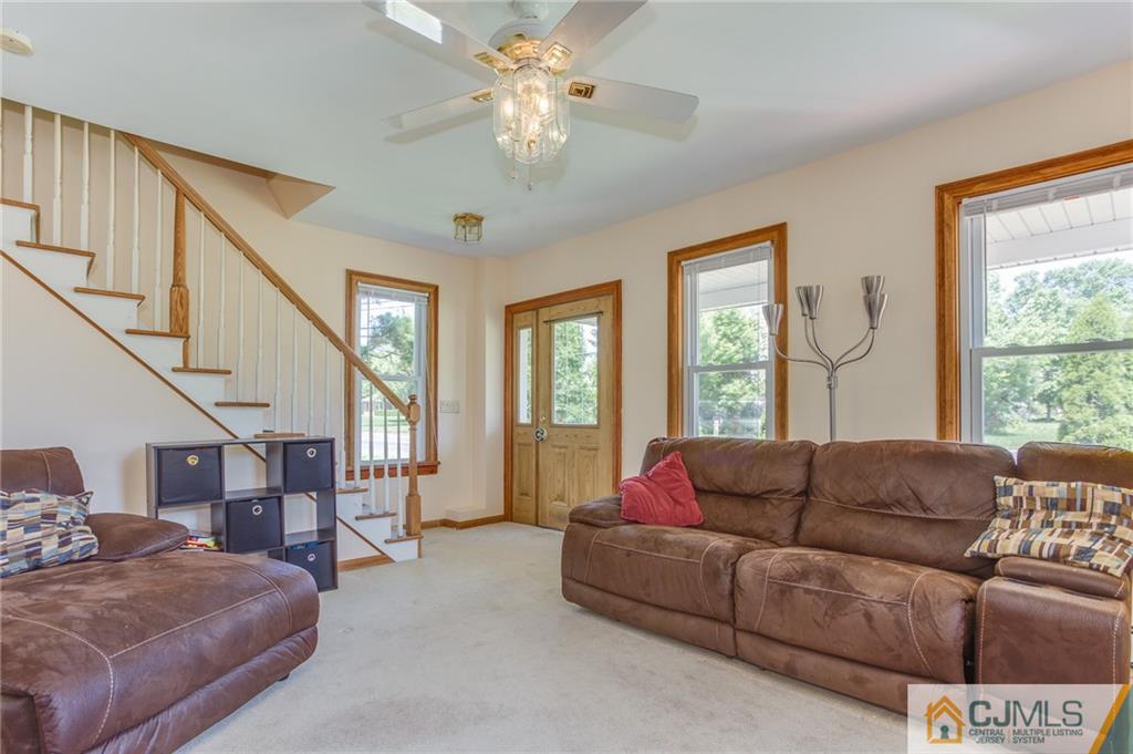 659 Ridge Road Monmouth Junction, NJ 08852 - Photo 5 of 24 a living room with furniture and a large window
