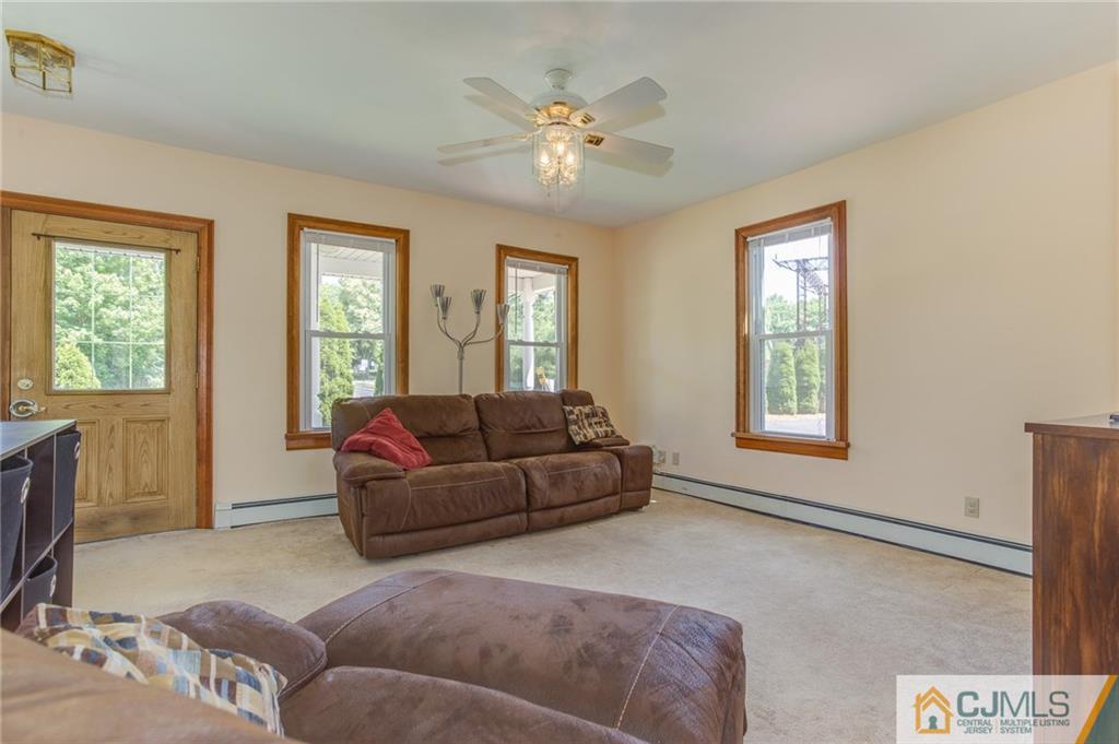 659 Ridge Road Monmouth Junction, NJ 08852 - Photo 6 of 24 a living room with furniture and a window