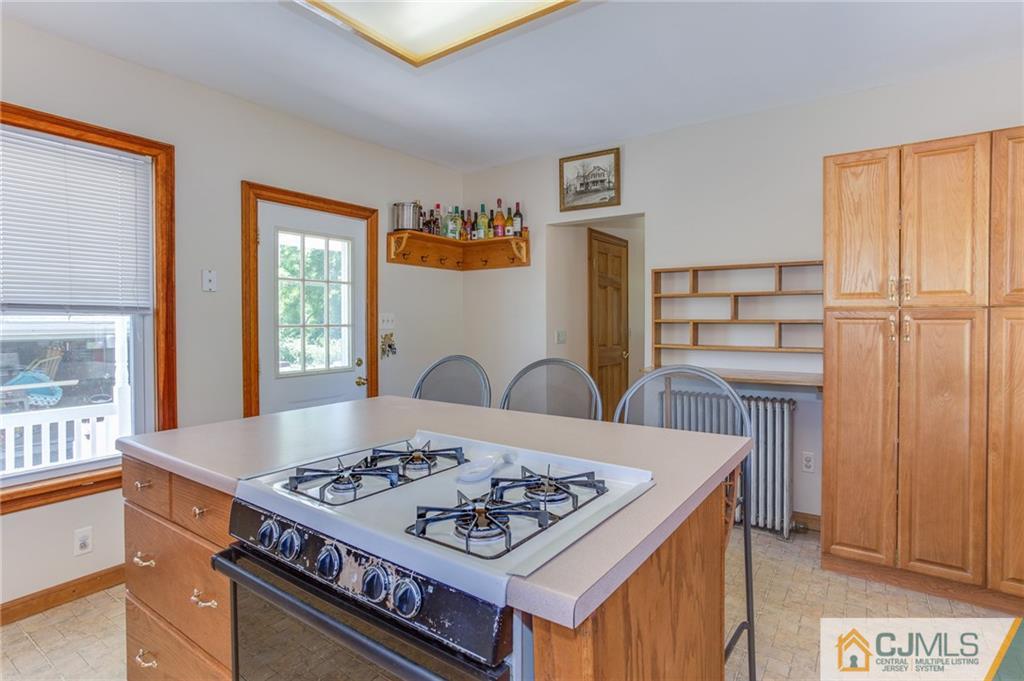 659 Ridge Road Monmouth Junction, NJ 08852 - Photo 10 of 24 a view of a kitchen counter space and a stove