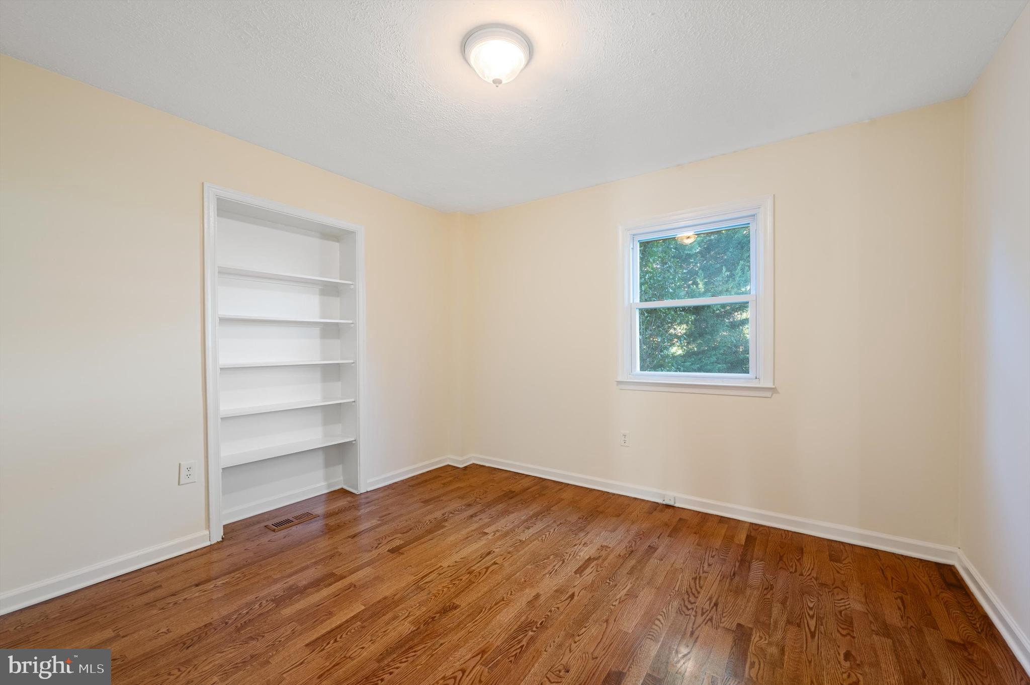 2801 Salem Church Road Berryville, VA 22611 - Photo 27 of 68 a view of empty room with wooden floor and fan