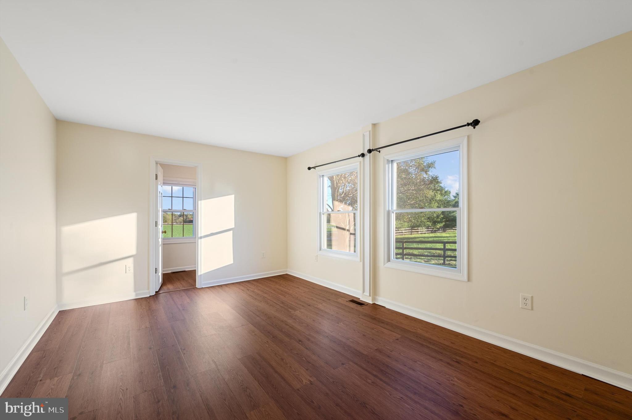 2801 Salem Church Road Berryville, VA 22611 - Photo 33 of 68 a view of a big room with wooden floor and windows
