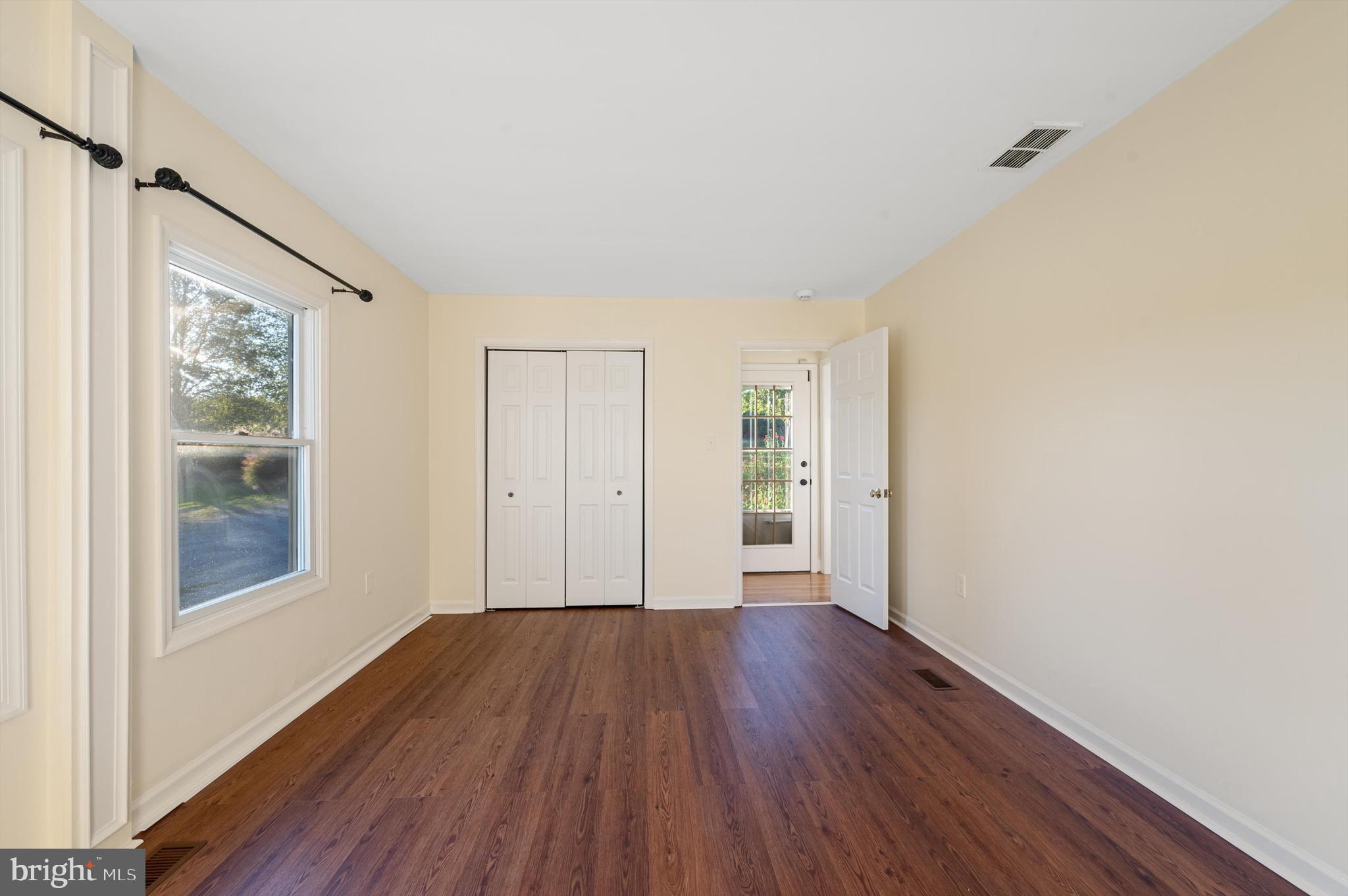 2801 Salem Church Road Berryville, VA 22611 - Photo 34 of 68 a view of an empty room with wooden floor and a window