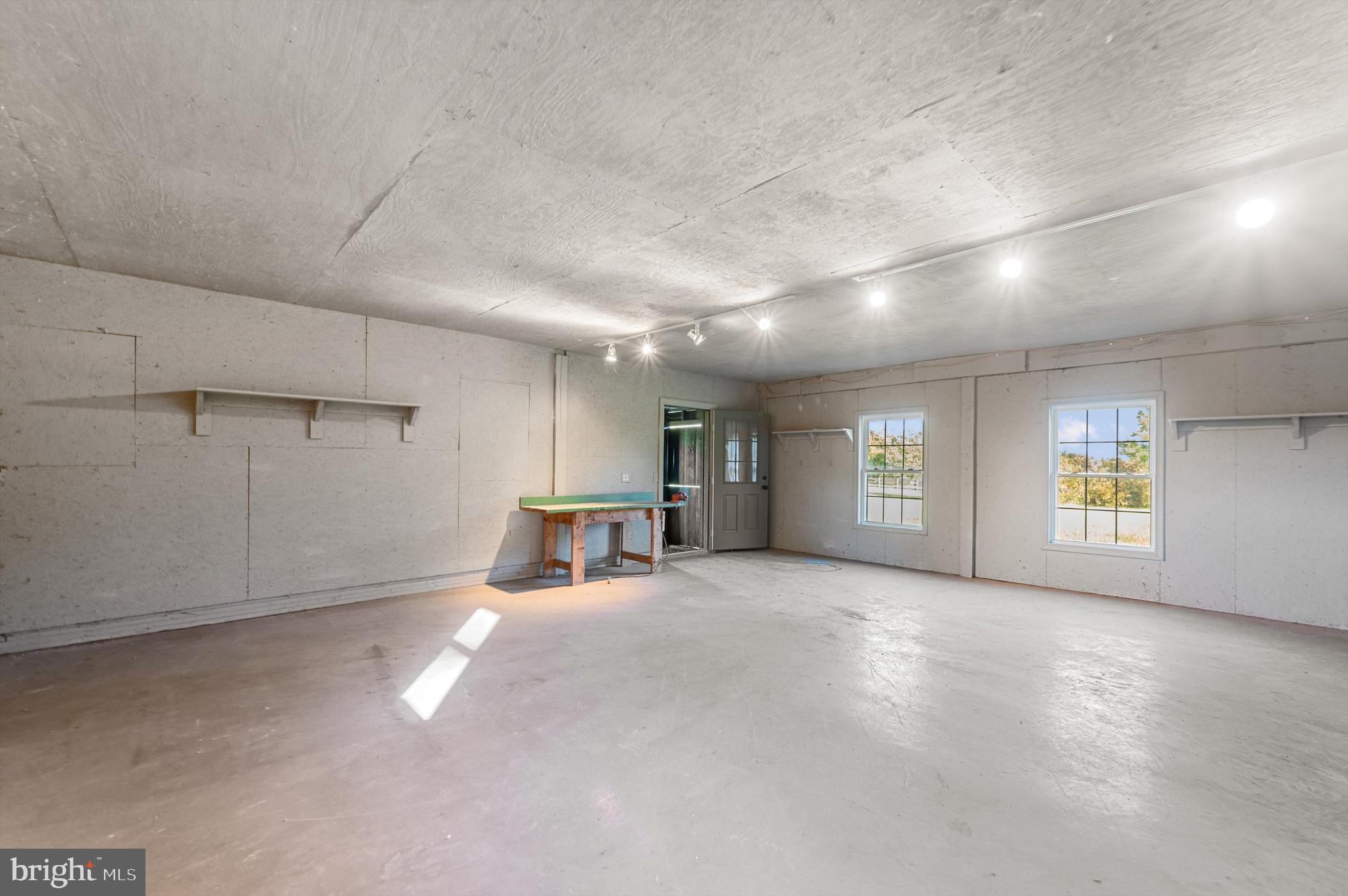 2801 Salem Church Road Berryville, VA 22611 - Photo 61 of 68 an empty room with windows and fireplace