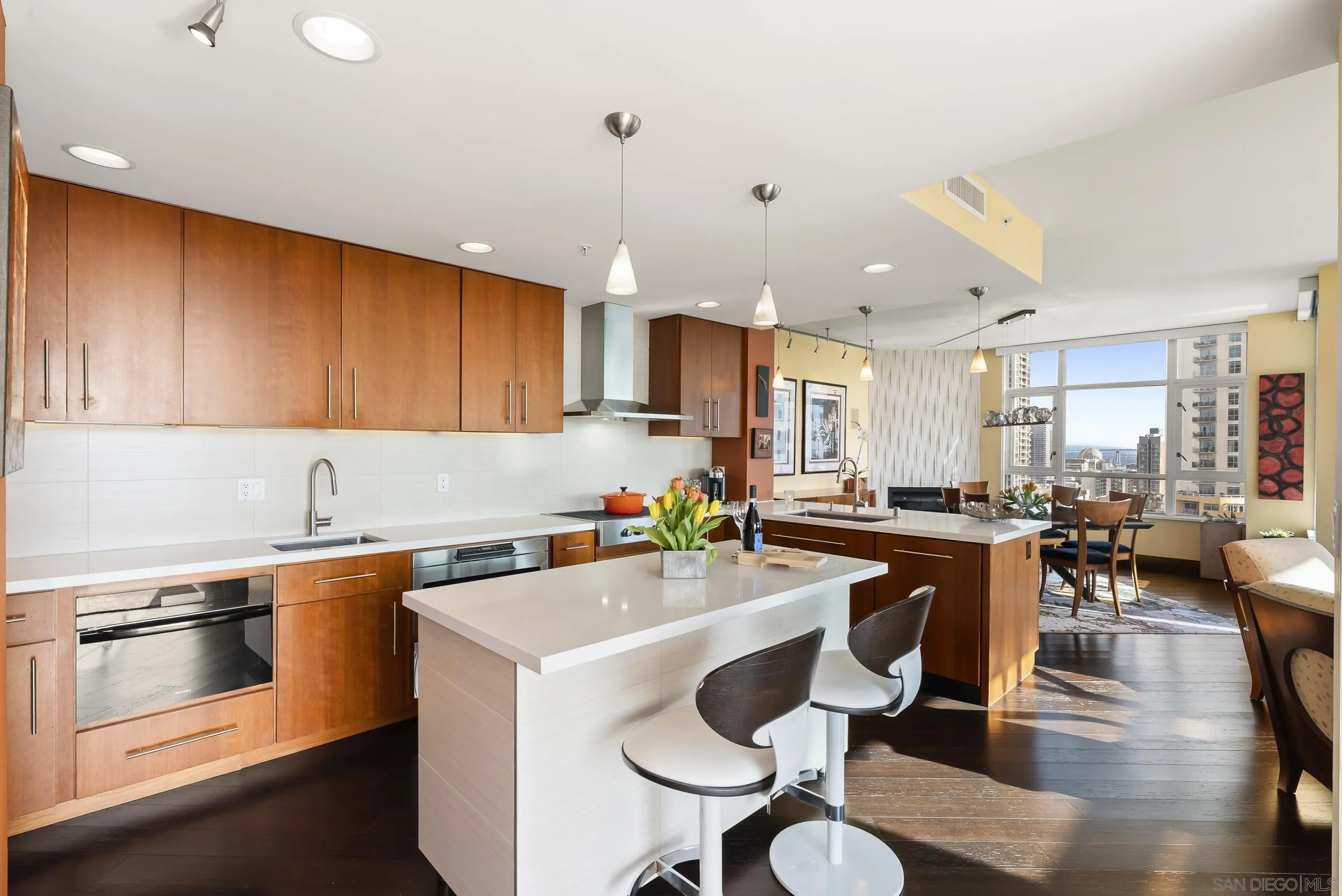 850 Beech Street, Unit 1205 San Diego, CA 92101 - Photo 17 of 66 a kitchen with a sink cabinets and wooden floor