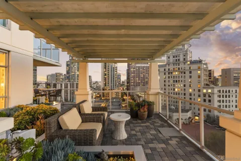 a terrace with outdoor seating and city view