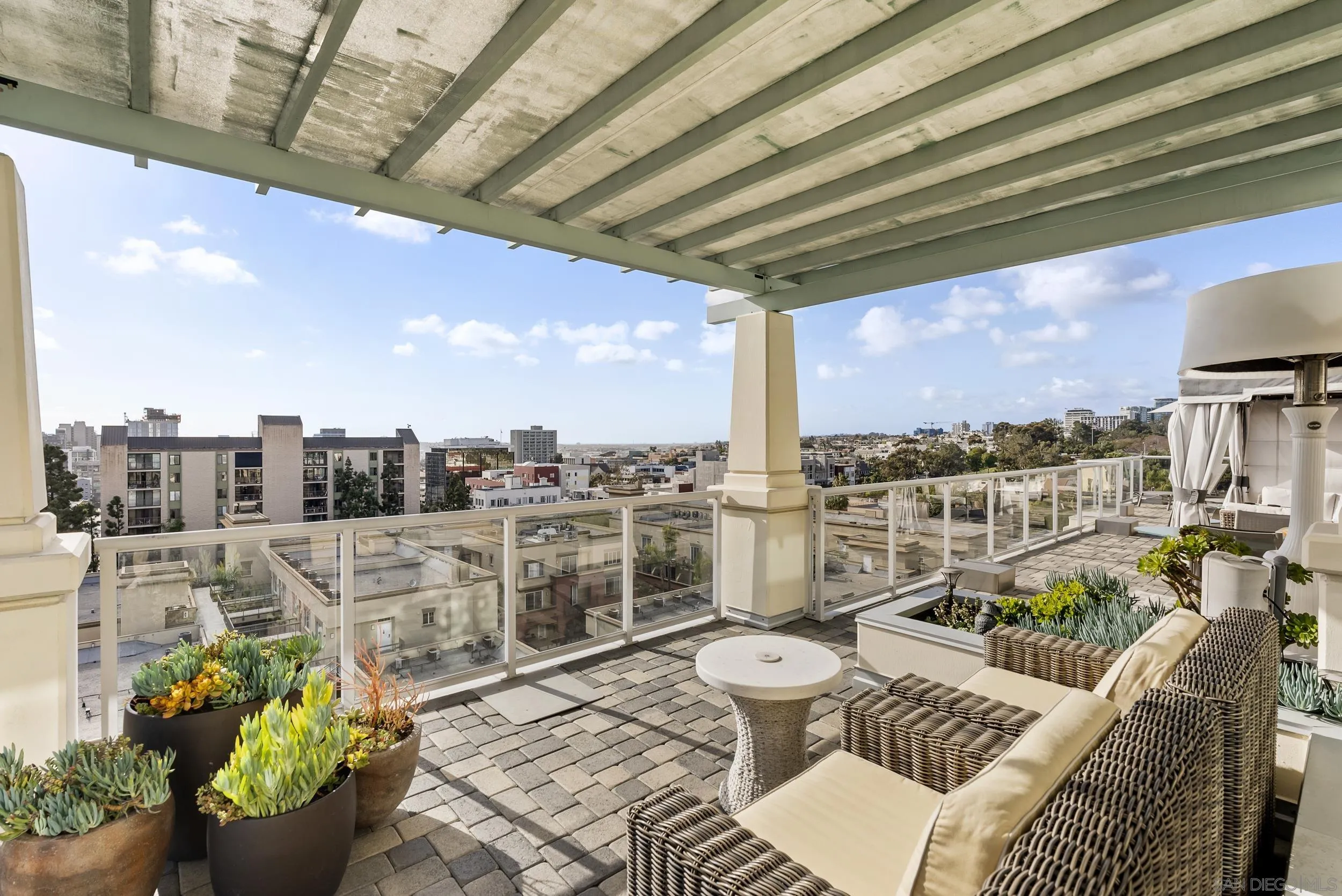 850 Beech Street, Unit 1205 San Diego, CA 92101 - Photo 31 of 66 a view of a balcony with chairs and a potted plant