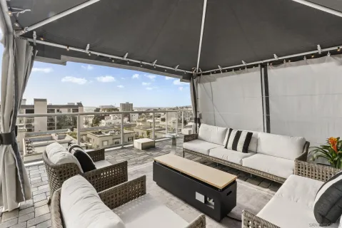 a view of a terrace with furniture and stove