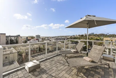 a view of a chairs and table in a patio