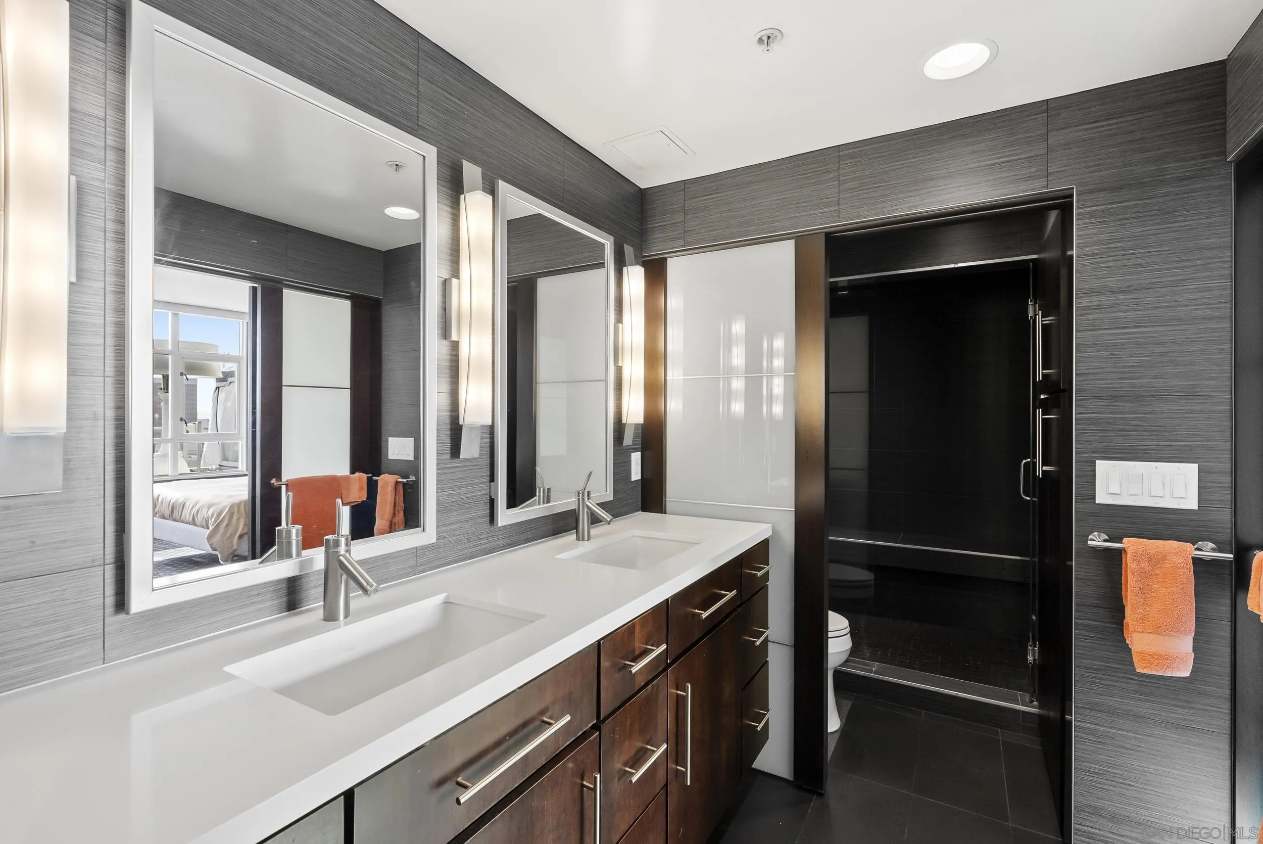 850 Beech Street, Unit 1205 San Diego, CA 92101 - Photo 46 of 66 a bathroom with a sink and a large mirror