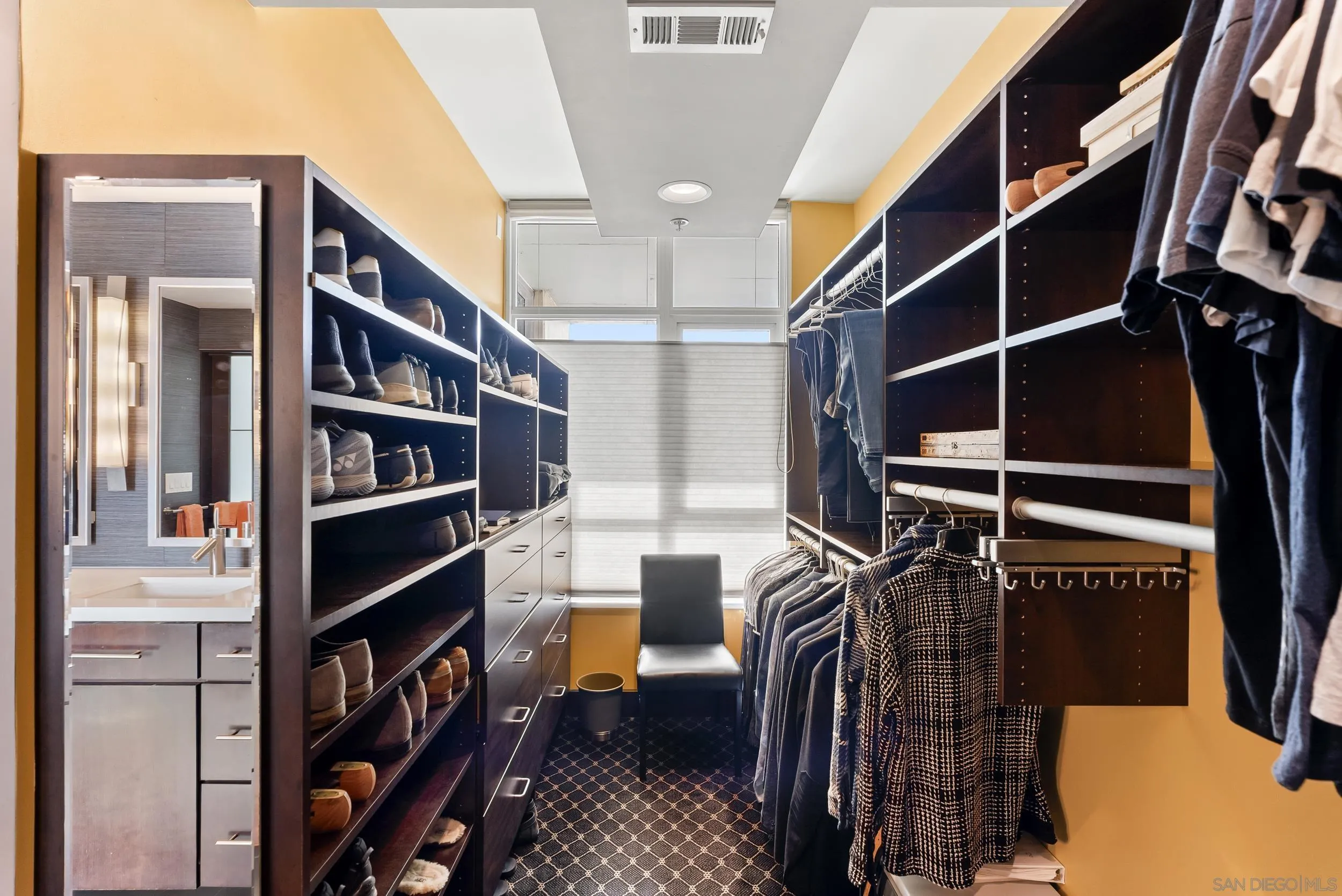 850 Beech Street, Unit 1205 San Diego, CA 92101 - Photo 48 of 66 a view of walk in closet with clothes and shoes