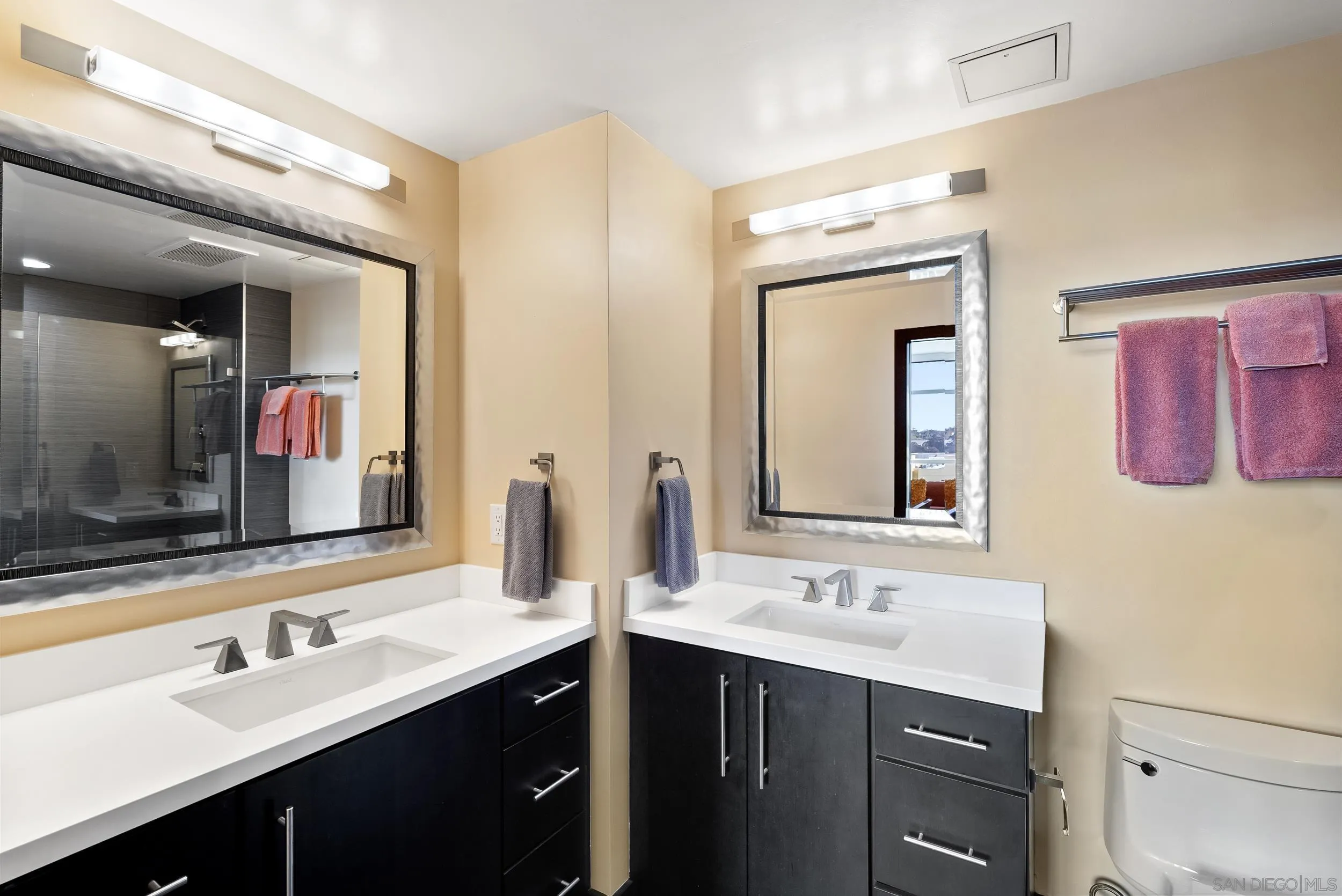 850 Beech Street, Unit 1205 San Diego, CA 92101 - Photo 50 of 66 a bathroom with a double vanity sink mirror and