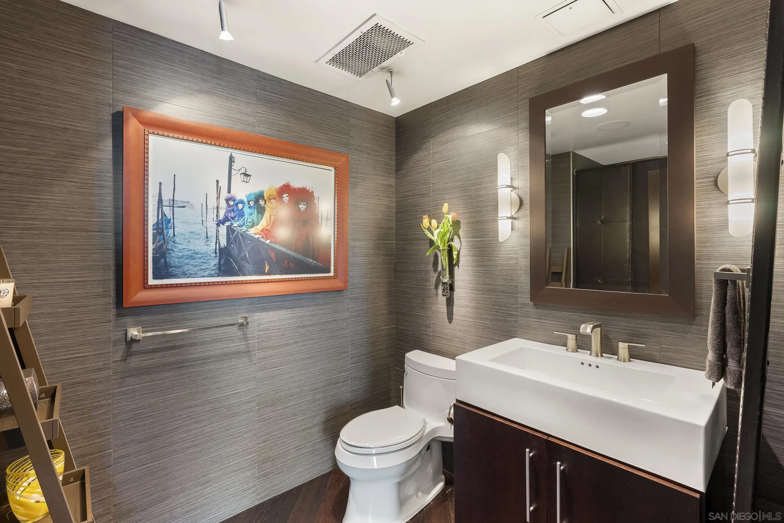 850 Beech Street, Unit 1205 San Diego, CA 92101 - Photo 53 of 66 a bathroom with a toilet a sink and mirror