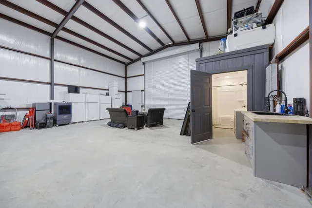 a living room with lots of furniture and a chandelier