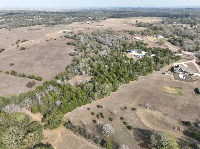 an aerial view of house with yard