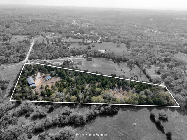 an aerial view of house with beach