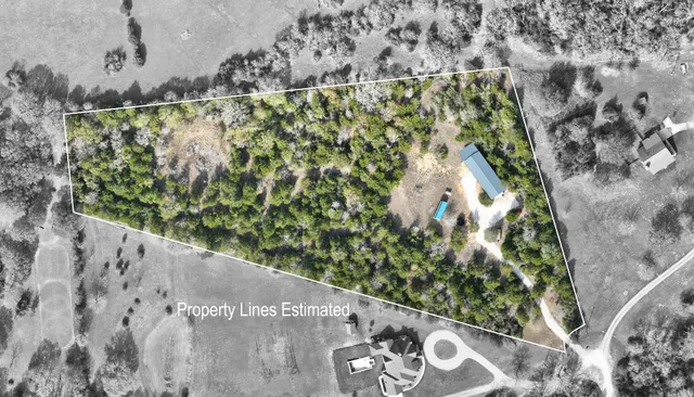 a living room with furniture a flat screen tv and a table