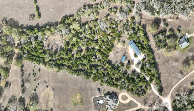 a view of a livingroom with furniture and a ceiling fan