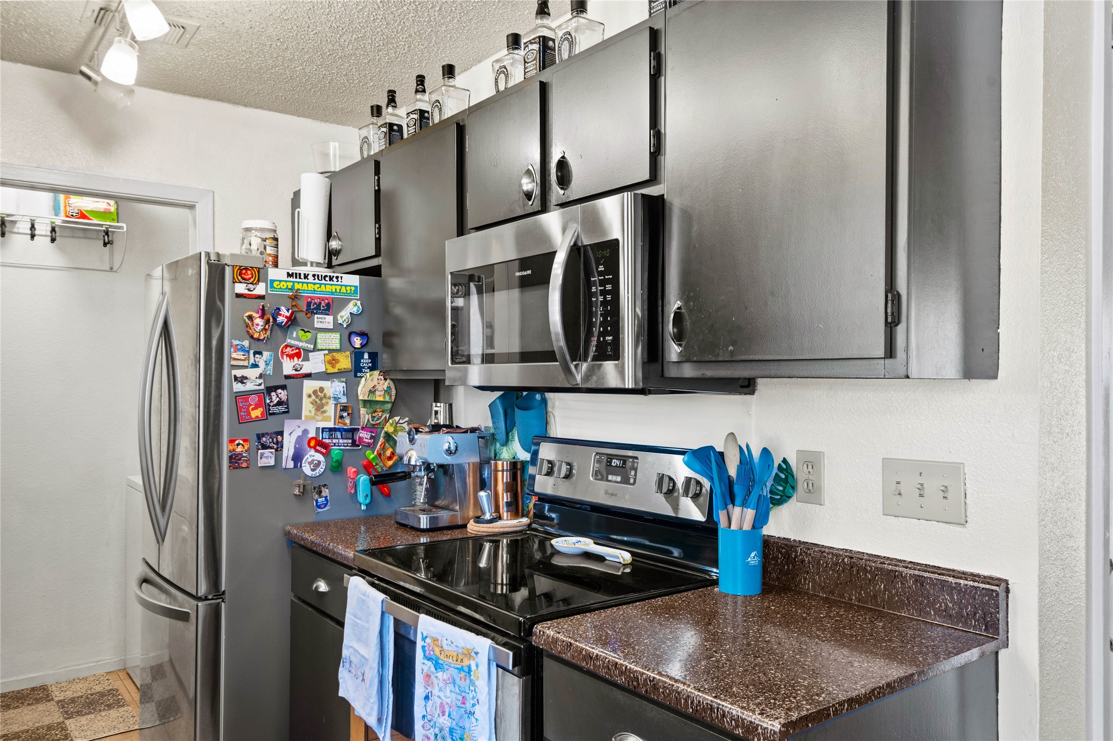 2018 West Rundberg Lane, Unit 4B Austin, TX 78758 - Photo 11 of 28 a kitchen with stainless steel appliances granite countertop a sink stove and refrigerator