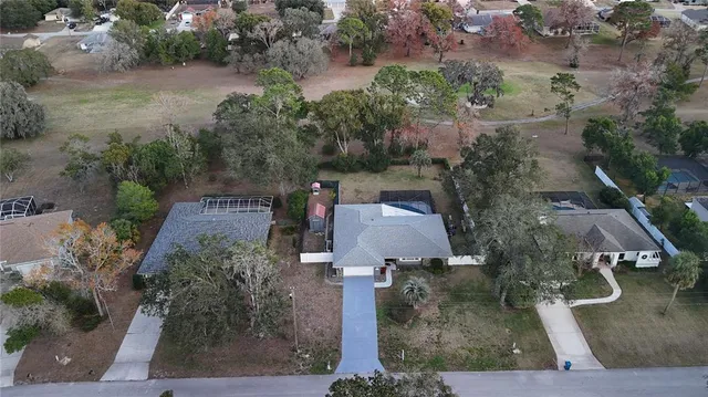 an aerial view of a house with outdoor space