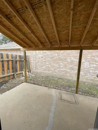 a view of a backyard of the house