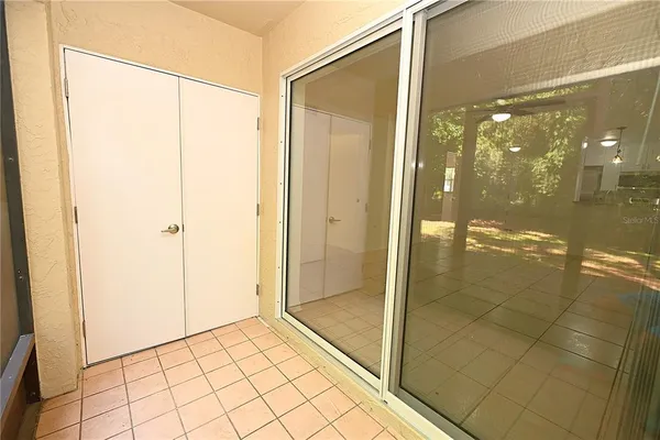 a bathroom with a glass shower door