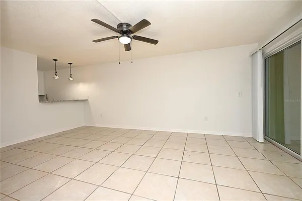 a view of an empty room and wooden floor
