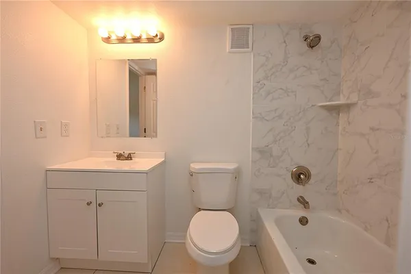 a bathroom with a bathtub and shower