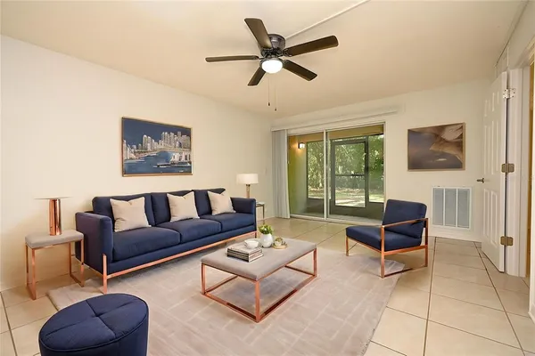 a living room with furniture and a window