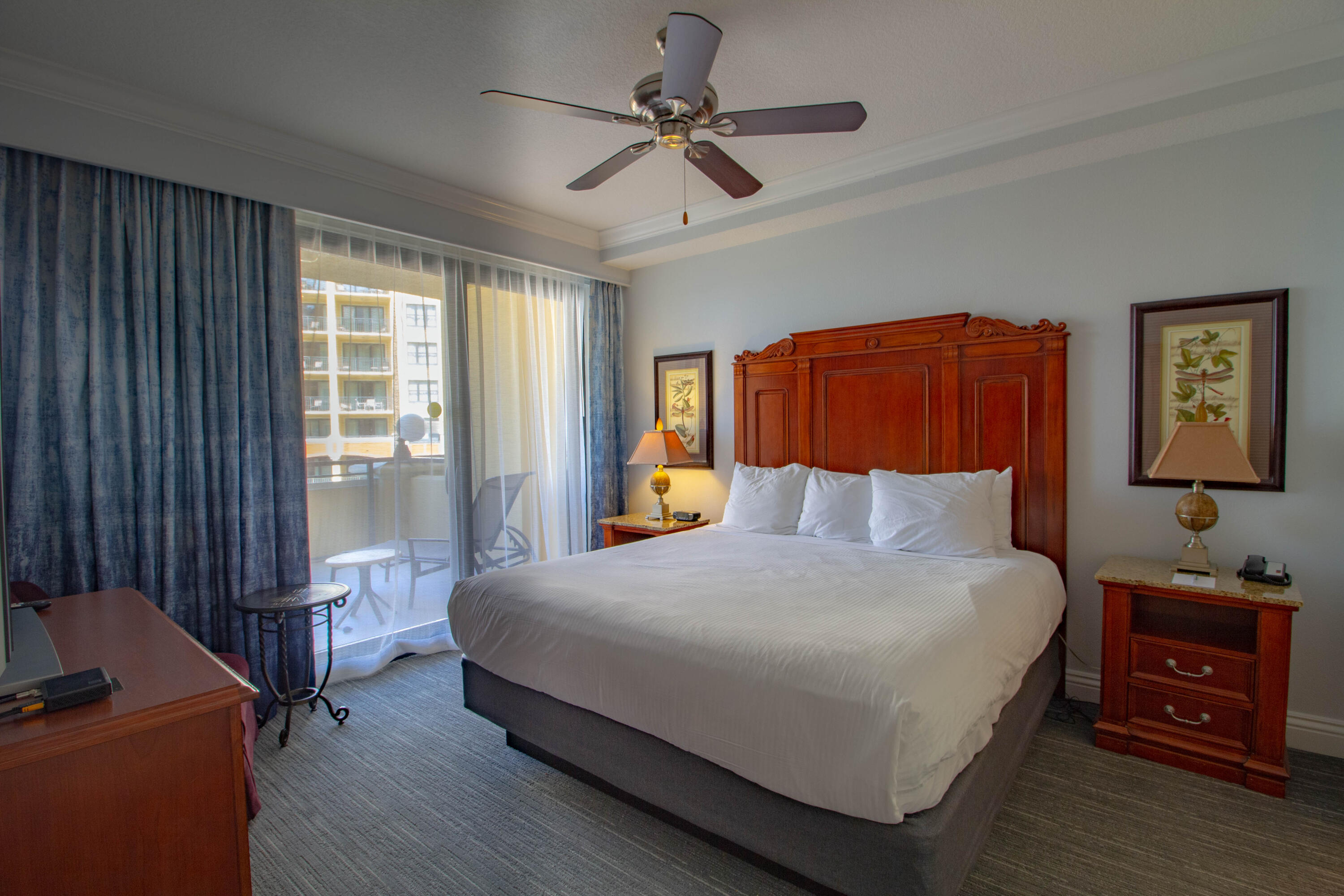 10 Harbor Boulevard, Unit E802C Destin, FL 32541 - Photo 9 of 24 a bedroom with a bed and a chandelier