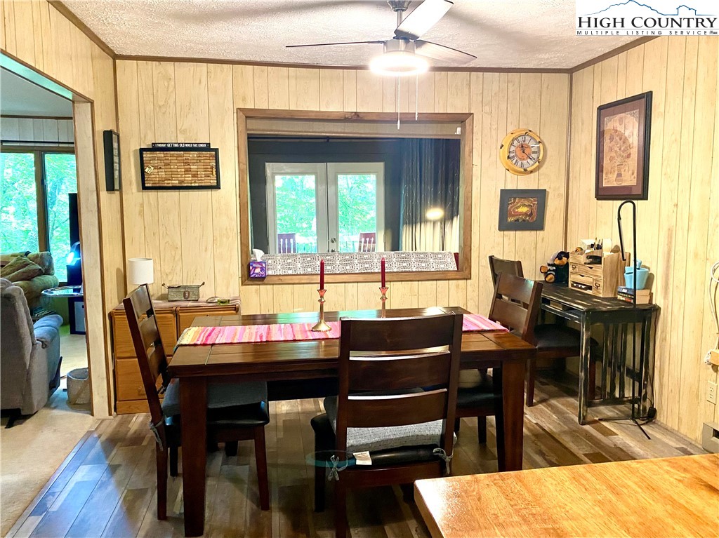 175 Ash Loop Newland, NC 28657 - Photo 18 of 46 a view of a dining room with furniture window and wooden floor