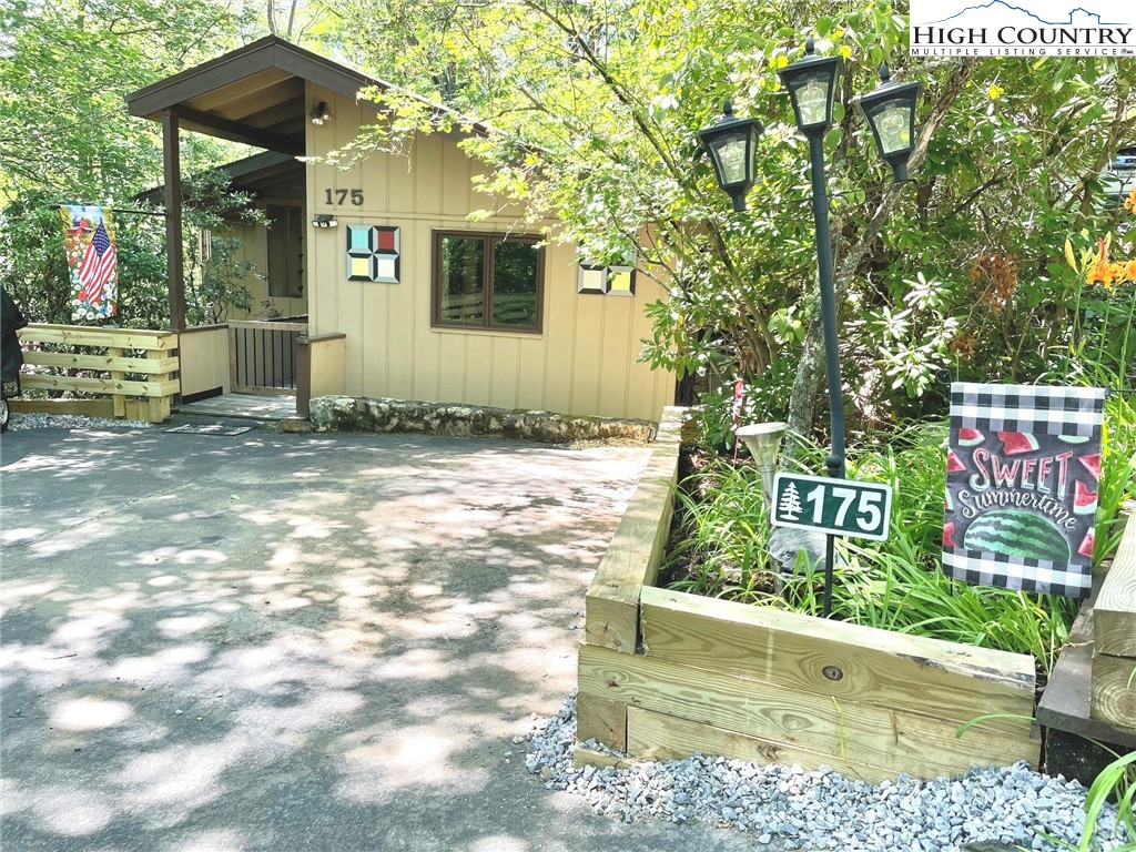 175 Ash Loop Newland, NC 28657 - Photo 2 of 46 a front view of a house with garden