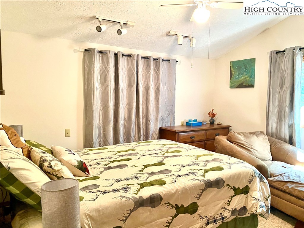 175 Ash Loop Newland, NC 28657 - Photo 23 of 46 a bedroom with a bed and a window