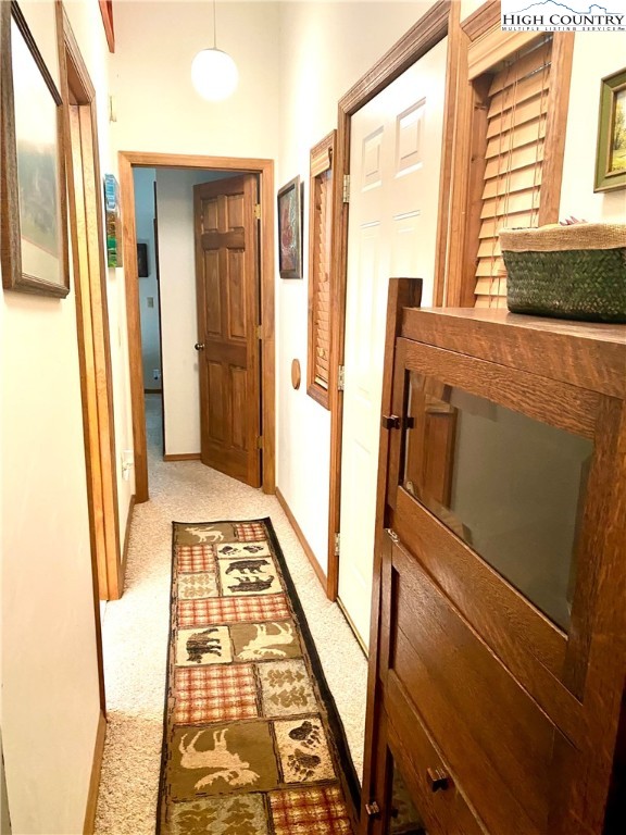 175 Ash Loop Newland, NC 28657 - Photo 27 of 46 a view of a hallway with wooden floor and staircase