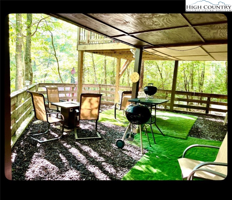175 Ash Loop Newland, NC 28657 - Photo 35 of 46 a living room view with a floor to ceiling window and outdoor view