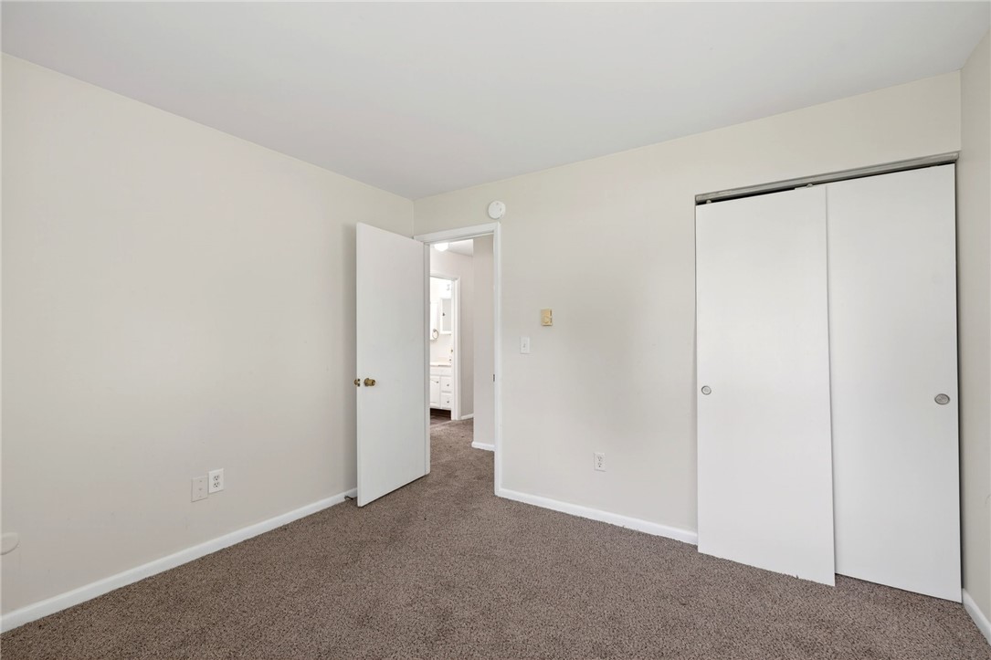 3659 Trail-On Road Dayton, OH 45439 - Photo 20 of 38 This cozy bedroom features plush carpeting and a convenient closet, creating a comfortable and practical space.
