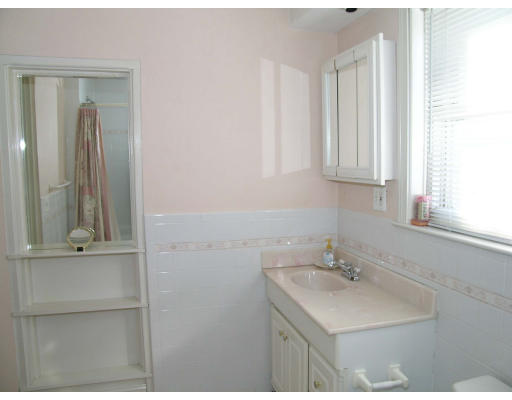 38 Holbrook Street Boston, MA 02130 - Photo 11 of 11 a bathroom with a sink and a mirror