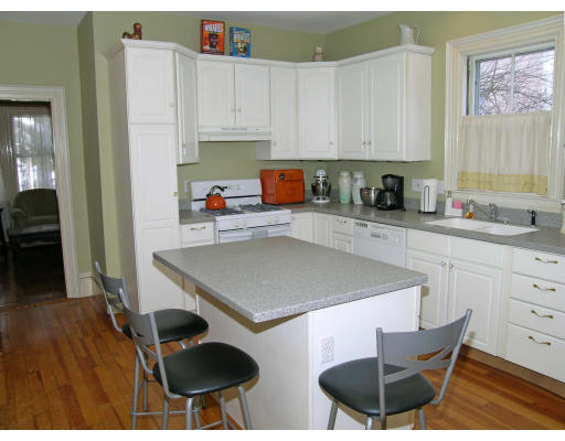 38 Holbrook Street Boston, MA 02130 - Photo 5 of 11 a kitchen with stainless steel appliances a stove a sink a cabinets and a refrigerator