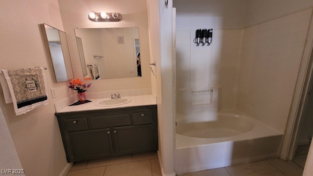 1830 North Pecos Road, Unit 155 Las Vegas, NV 89115 - Photo 15 of 23 Bathroom with tile patterned floors, vanity, and bathing tub / shower combination