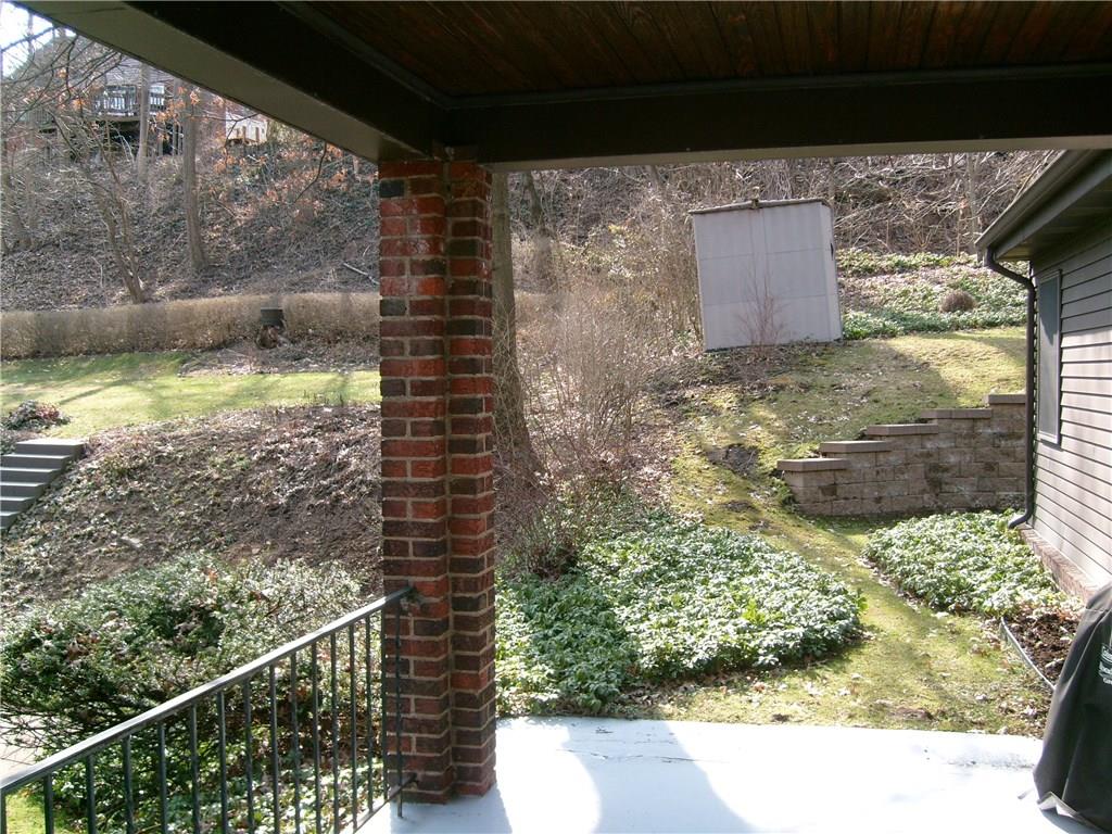 220 Cascade Road Forest Hills, PA 15221 - Photo 22 of 25 Covered side porch leading to back yard. Shed included.