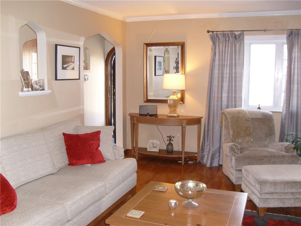 220 Cascade Road Forest Hills, PA 15221 - Photo 7 of 25 Living room with archway to front door.