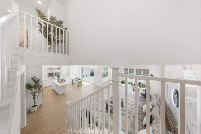 a bathroom with a tub shower sink and mirror