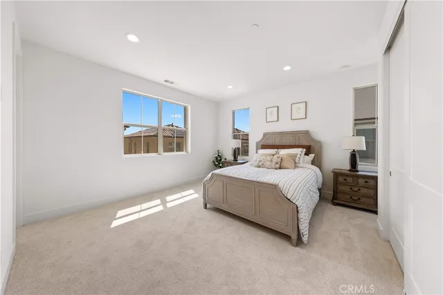 a white toilet sitting next to a bath tub