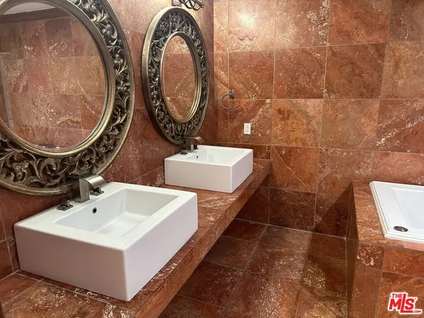a bath tub sitting next to a shower