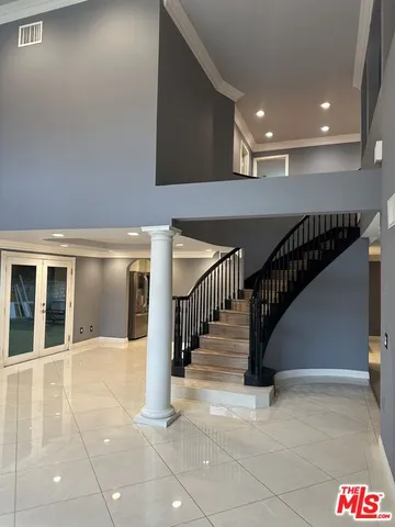 a kitchen with kitchen island sink and granite counter tops