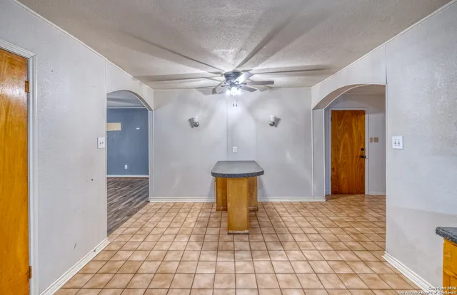 a view of a hallway with a chandelier