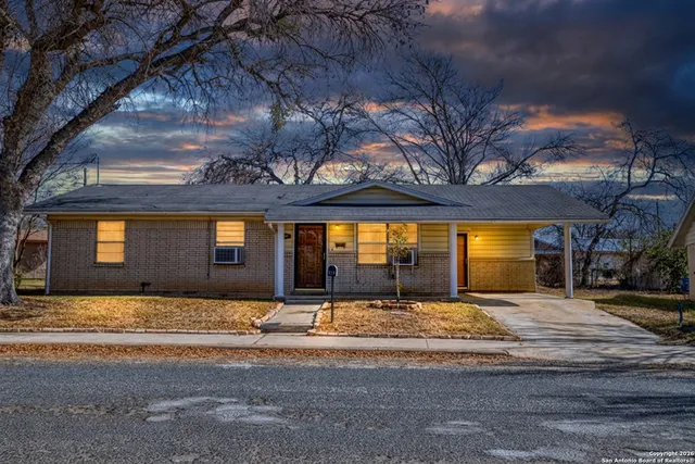 a view of a building with a cars