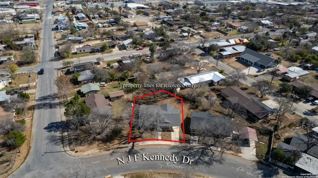 an aerial view of houses with outdoor space